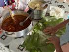 My host mom preparing the banana leaves for tamales