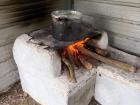 The tamales cooking over the wood fire
