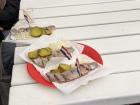 Trying fresh Dutch haring, a famous fish snack in the Netherlands!