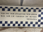 Socrates quote written in Portuguese at a metro station.