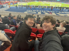 My friend and me posing at a football match in Paris, France. 