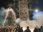 A marching band plays music for the castillo, a tower of fireworks