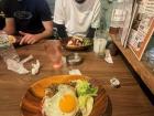 Eating chicken, eggs and rice at a restaurant with friends in Osaka