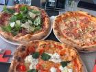 Some uncut pizza's in Italy