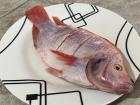 Mojarra during the preparation stage; it's a red mojarra, but there are other colors with different flavors 