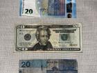 Different currencies: The Euro (Portugal), The U.S. Dollar (United States) and The Dalasi (The Gambia)