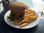 A hamburger (hamburguesa) from a local restaurant (soda)