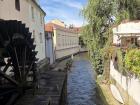 This is Prague's own "Little Venice" in Malá Strana, featuring a 16th-century water wheel and Kabourek, a water sprite from Czech folklore
