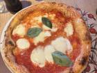 Some pizza here is so thin you have to eat it with a fork so it doesn't fall apart!