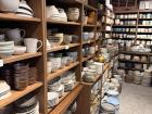 A photo of a famous pottery shop with lots of ceramics tucked away in a quiet shopping district