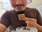 Enjoying a biscuit and coffee
