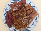 This is noodles from a Chinese restaurant with chicken, pork and duck
