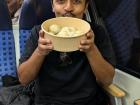 My friend Josh holding the momos we ordered at "Namaste Momo" in Frankfurt