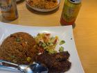 Nigerian Jollof rice with jerk chicken and malt