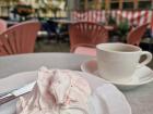 A fika break in the city with strawberry meringue and coffee