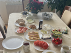 Traditional Polish breakfast with classic dishes such as naleśniki (crepes) and wędzony łosoś (smoked salmon)