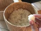 Sticky rice served in a traditional basket called a thip khao