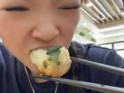 Me biting into the steaming hot bun