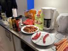 A spread of hot dogs and toppings. You can see both vegetarian hot dogs and red hot dogs, called rød pølse.