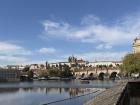 A sunny view of the Vltava River, Charles Bridge and Prague Castle