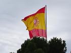 The red and yellow stripes represent national identity and unity with the coat of arms drawn in the middle