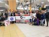 Peace Corps staff welcoming volunteers at the airport. 