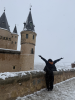 Chloe stands by a castle in Segovia, Spain.