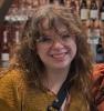A young white woman with brown hair and glasses